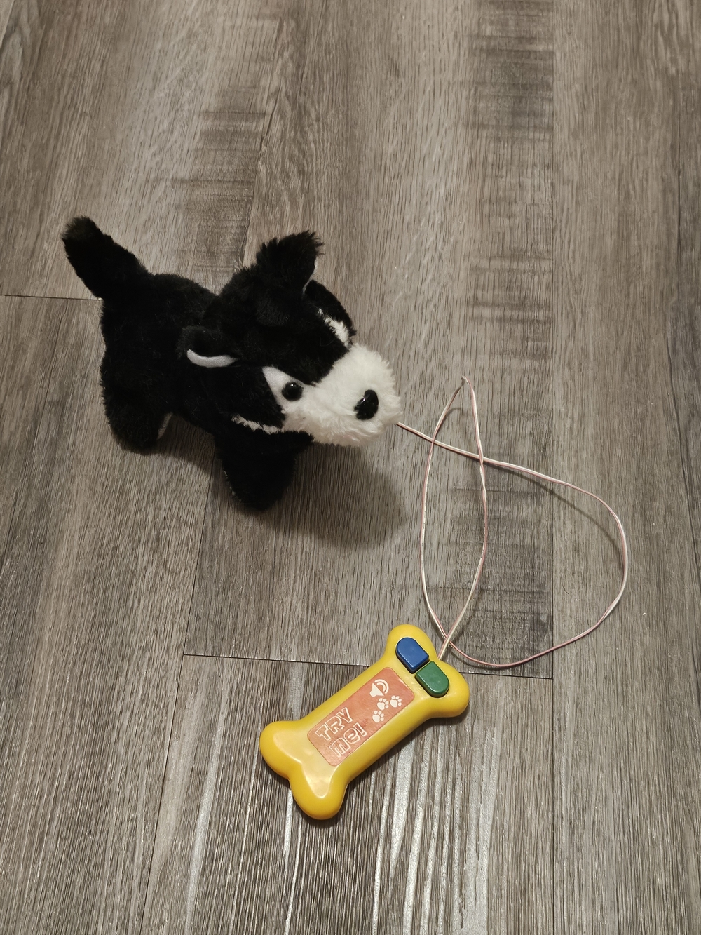 Plush Black and White Dog Toy with Yellow Bone Remote - Interactive Pet Toy